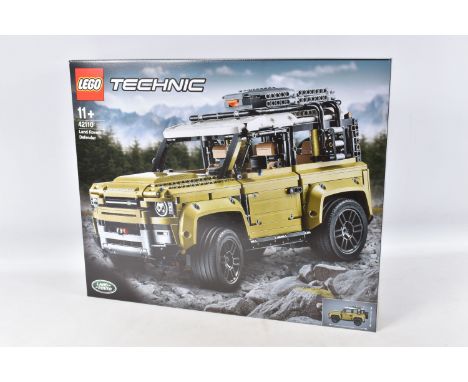 A LEGO TECHNIC LAND ROVER DEFENDER MODEL KIT, numbered 42110, factory sealed box with seal number 32S9, perforated handles on