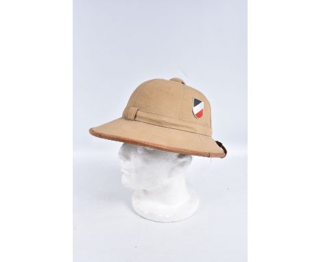 A WWII ERA GERMAN AFRIKACORPS PITH HELMET WITH DECALS, this is the beige coloured tropical sun hat with an army decal on one 