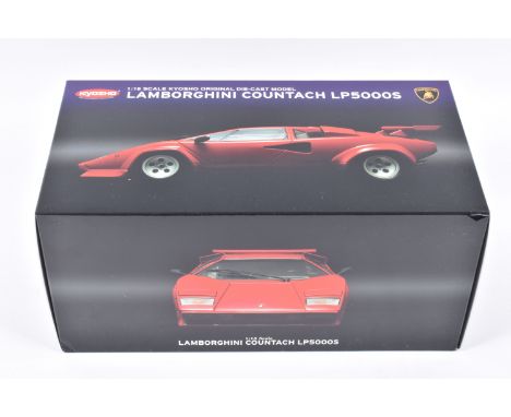 A BOXED KYOSHO LAMBORGHINI COUNTACH LP 5000S 1:18 SCALE MODEL VEHICLE, numbered 08322RR, in red, appears in new condition ins