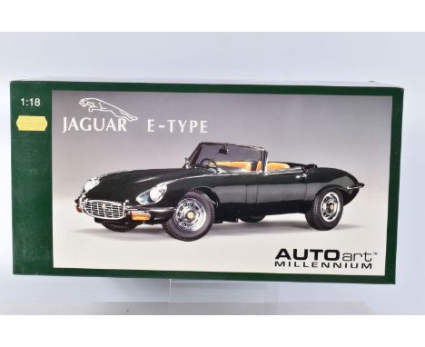 A BOXED AUTOART MILLENIUM JAGUAR E-TYPE ROADSTER SERIES III V12 1:18 SCALE MODEL, numbered 73522, in green, model appears in 