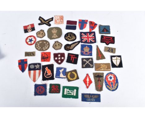 A NICE SELECTION OF UNIFORM INSIGNIA COLLECTED BY V.A.D NURSE JESS WINIFRED CAREY DURING WWII, Miss Carey was stationed out i