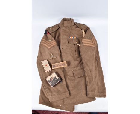 A WWI ERA BRITISH ARMY SERVICE DRESS TUNIC AND OTHER WWI COLLECTABLES, the jacket has Royal Artillery buttons, blue overseas 