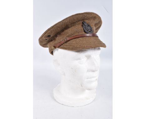 A WWI ERA BRITISH ARMY PEAKED CAP WITH LEEDS RIFLES CAP BADGE, the hat is in good condition and has a blackened badge on the 
