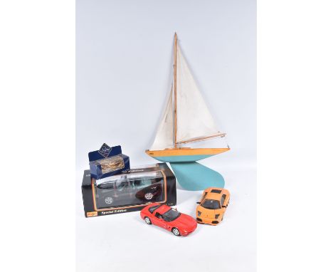 A BOWMAN POND YACHT, 'Gull', green hull with varnished deck, complete with mast and sail and in very good condition, but has 