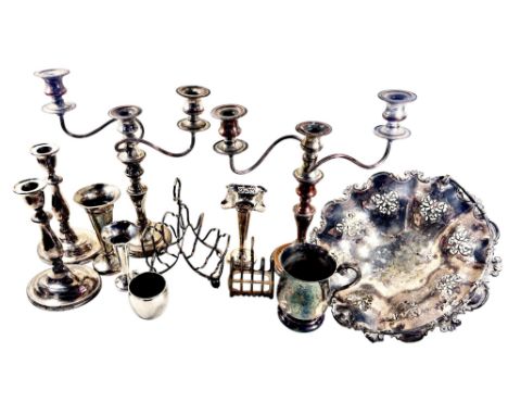 A large collection of mixed silver plated items to include candlesticks, bread basket, posy vases, large toast rack, tureens 