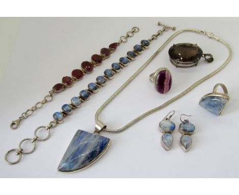 Collection of silver gem set jewellery comprising a Blue John dress ring, a large oval smoky quartz pendant, a ruby bracelet 
