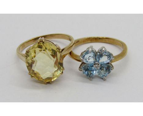 Two vintage 9ct gem set dress rings; a claw set citrine example, size R/S and a blue gem floral cluster example with diamond 