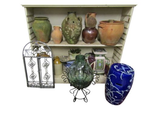 A group of weathered terracotta and other garden pots, planters etc, a ceramic elephant and barrel shaped seats together with