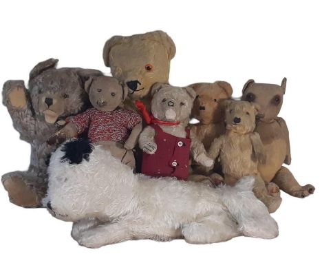 Seven teddy bears including vintage playworn  bears in need of varying degrees of restoration together with a dog pyjama case