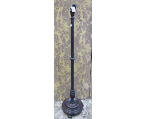 A turned and fluted oak standard lamp 