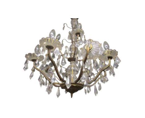 A vintage French twelve light chandelier with clear hanging droplets 