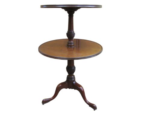 A Georgian mahogany two-tier dumb waiter with wide and fluted column support on a tripod base 99H x 62D (maximum) 
