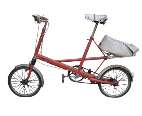 A vintage Moulton bicycle in red livery finish. 