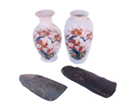 Two prehistoric flint axe heads and two small Japanese vases, with cherry blossom decoration, 10cm