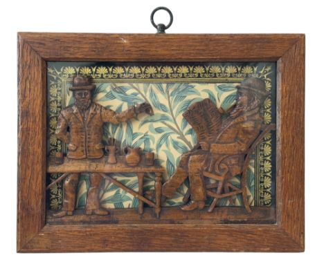 A folk art carved wood relief of two gentlemen in conversation, late 19th/early 20th century, with printed paper background i