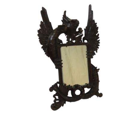 A 19th century easel mirror framed by a carved wood dragon, 48cm x 34cm.