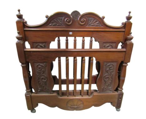 A Victorian mahogany 4ft 6 double bedstead with open vertical turned rails and carved panels 