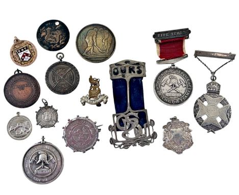 A leather box containing a Shanghai Volunteer Fire Brigade Medal with five years service clasp, together with another "Deluge