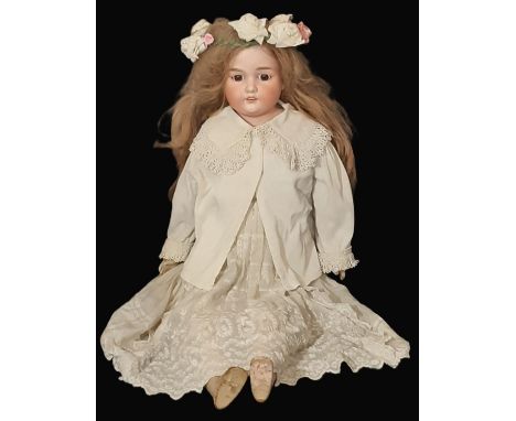 Early 20th century large bisque shoulder-head doll by Armand Marseille with fixed brown eyes, composition lower limbs and dre