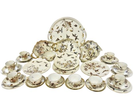 A Prikenhammer 19th century dessert and tea service with bird, insect and floral detail including graduated plates, trios, co