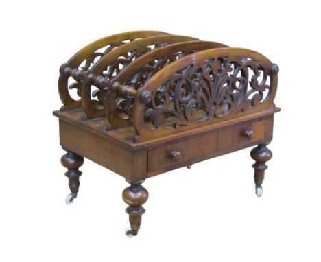 A good quality Victorian rosewood Canterbury with scrolling pierced panels over a single drawer raised on turned supports and
