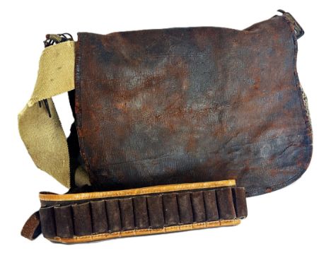 A distressed vintage game bag together with a cartridge belt, head torch and a Cobra Eclipse 21 four section monopod.