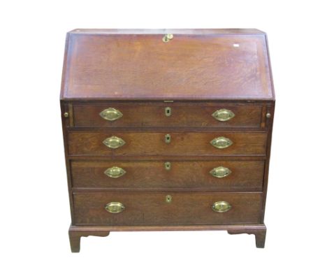 A George III oak bureau with mahogany crossbanding, the fall flap revealing a fitted interior over four long drawers on brack