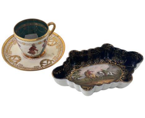 A 19th century Dresden pin dish, central panel depicting a highwayman and victim, within a blue and gilt border, together wit