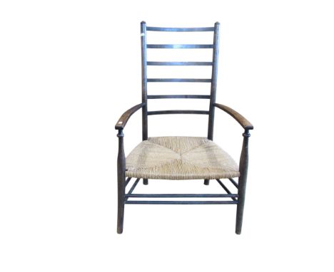 A low Arts and Crafts  vernacular ladder back elbow chair with rush seat 