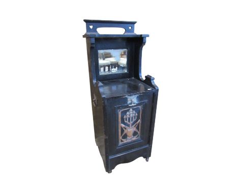 An art nouveaux coal purdonium with lacquered finish and pierced panel decoration, 97 cm high, 36 x 33 cm