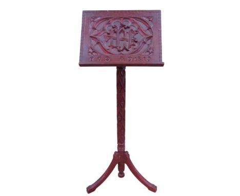 A small 19th century ecclesiastical lectern with carved detail and swept tripod supports dated 1850, 94 cm high