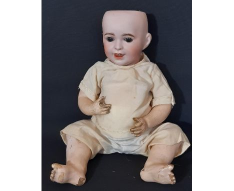 SFBJ bisque head laughing character baby, with blue sleeping eyes, open mouth with two top teeth and bent-limbed composition 