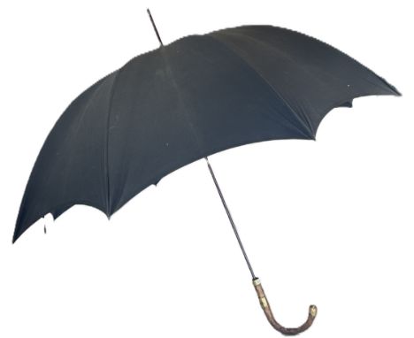 A vintage black umbrella with 18ct gold plated mounts. 