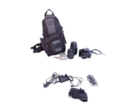 A Canon EOS 1100D  digital camera together with a Canon EFS 18-55mm lens and a Sigma DG 70-300mm zoom lens and with a carry c