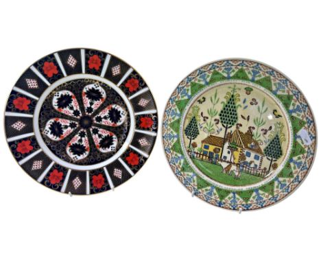 A Royal Crown Derby Imari dinner plate No. 1128 and a Royal Doulton Sampler pattern dinner plate 