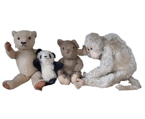 Four vintage soft toys including 'Johnson's Baby Panda' with label to foot, a monkey pyjama case by Farnell Alpha Toys and tw