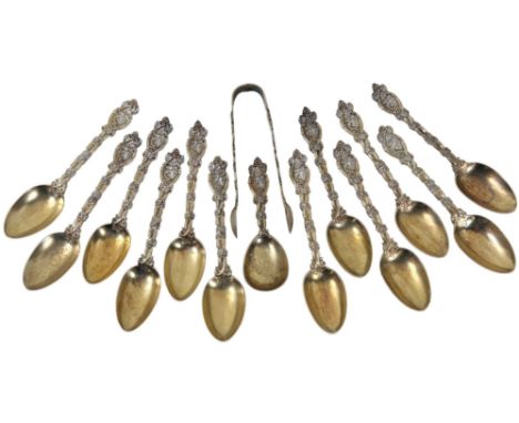 A cased set of twelve Victorian silver-gilt spoons with associated tongs and caddy spoon, London 1869 by Henry Holland (Holla