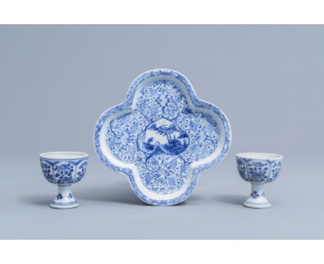 Full title: A pair of Chinese blue and white stem cups with floral design and a four-lobed teapot stand, KangxiDescription: D