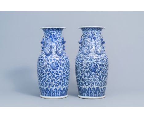 Full title: A pair of Chinese blue and white 'lotus scroll' vases with relief design, 19th C.Description: H 46 cm