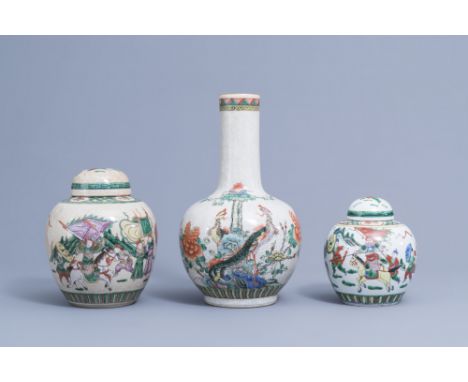 Full title: A Chinese bottle shaped Nanking crackle famille verte vase and two warrior jars, 19th/20th C.Description: H 39,2 