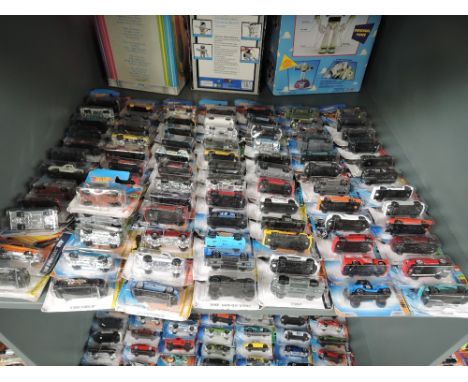 A shelf of 21st century Mattel Hot Wheels diecasts, mainly 2006 onwards, all in blister packs, approx 80