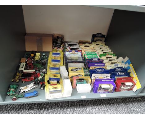 A shelf of modern diecasts including, Lledo, Atlas, Matchbox and similar most boxed or on cards, approx 76