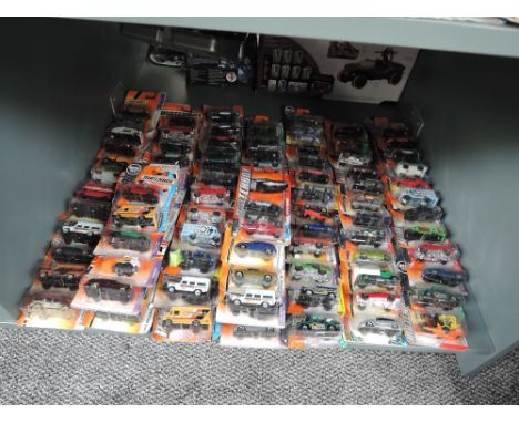 A shelf of 21st century Matchbox diecasts, mainly 2006 onwards, includes Hero and Adventure City series, all in blister packs