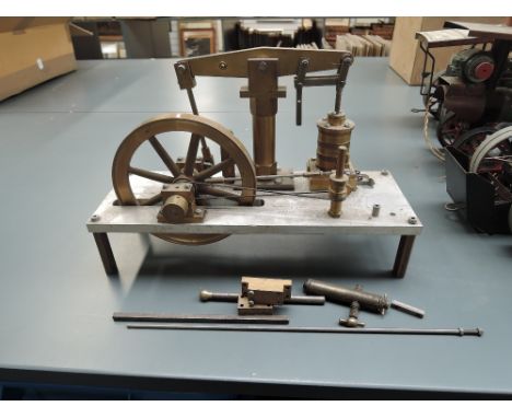 A part made brass Live Steam Beam Engine having single spoke wheel vertical piston, 15cm beam, on stand with extra parts pres