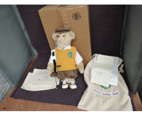 A limited edition modern Steiff Teddy Bear, Golfer Teddy Bear having white tag 01298/3000, 670671 with canvas bag, certificat