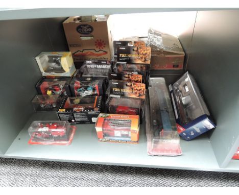 A shelf of  modern diecasts including Corgi Fire Heroes, Maisto Motor Cycles, Train on plinth etc, all boxed (17)