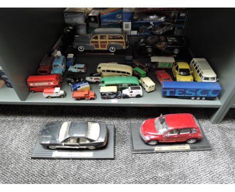 A shelf of modern diecasts including Maisto 1:18 scale 1948 Chevrolet Fleetmaster, BMW 850I. Chysler Cruiser and Jaguar XJ220