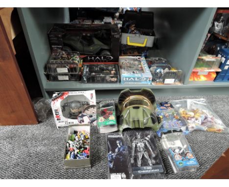 A shelf of modern figures and accessories including Halo, Terminator 2, Mag Warriors etc, on cards, boxed and loose