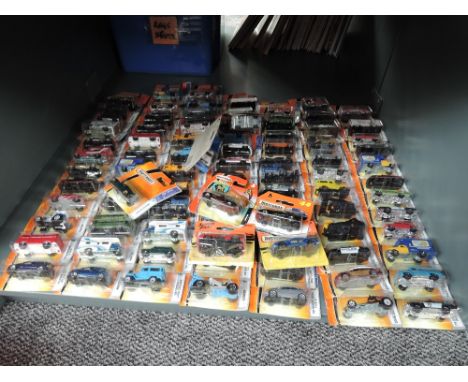 A shelf of 21st century Matcbox diecasts, mainly 2006 onwards, Superfast and Bonus series included, all in blister packs, app