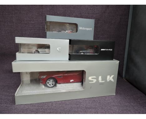 Four Paul's Model Art diecasts, 1:18 scale Mercedes SLK Class, 1:43 scale Mercedes Benz SLK 55 C Class &amp; AMG and Vodafone